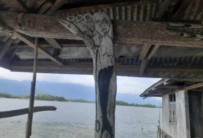 carving of a mermaid motif